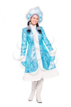 Young brunette posing in winter costume. Isolated on white