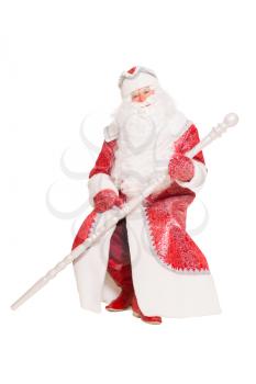 Santa Claus sitting and posing with a staff. Isolated on white