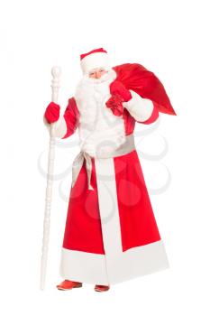 Santa Claus holding a gift bag. Isolated on white