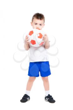 Playful little boy posing with a soccer ball. Isolated on white