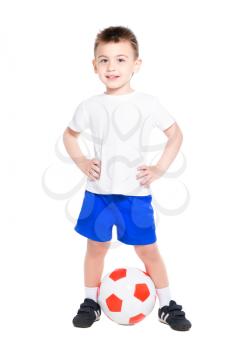 Cheerful nice boy posing in football uniform with ball. Isolated on white