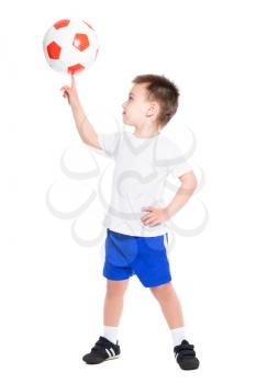 Nice little boy holding the ball on his finger. Isolated