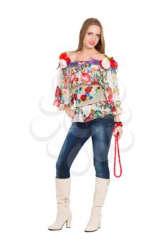 Attractive young woman posing in flowery blouse and jeans. Isolated on white