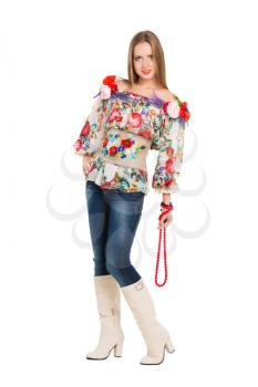 Sexy woman posing in flowery blouse and jeans. Isolated on white
