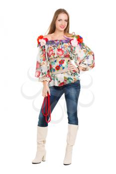 Sexy cheerful woman posing in flowery blouse and boots. Isolated on white