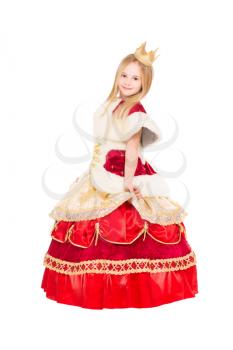 Smiling little girl posing in luxury queen dress. Isolated on white