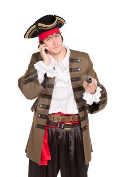 Portrait of young man in pirate costume talking on the phone. Isolated