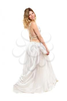 Smiling young lady posing in frank white wedding dress. Isolated