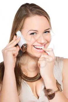 Portrait of cheerful blond woman with a mobile phone. Isolated on white