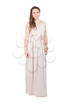 Elegant young blonde posing in long cream dress. Isolated on white