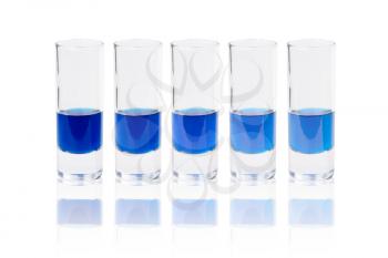 Six glasses with blue liquid. Isolated on white