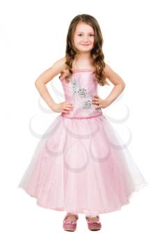 Little smiling girl posing in nice pink dress. Isolated on white