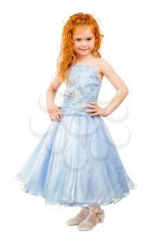 Cute little redhead girl posing in nice blue dress. Isolated on white