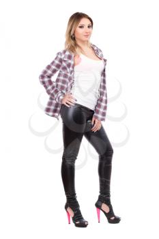 Alluring blonde wearing checked shirt and black pants. Isolated on white