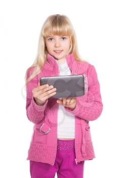 Portrait of nice little blonde with tablet. Isolated on white