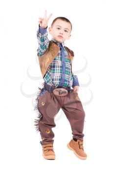 Little boy posing in cowboy costumes. Isolated on white
