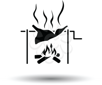 Roasting meat on fire icon. White background with shadow design. Vector illustration.