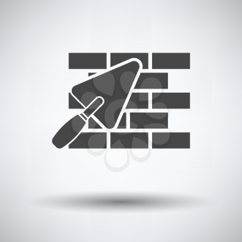 Icon of brick wall with trowel on gray background, round shadow. Vector illustration.