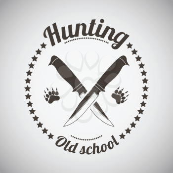 Hunting Vintage Emblem. Crossed Knifes and Bear Trails.  Dark Brown Retro Style.  Vector Illustration. 