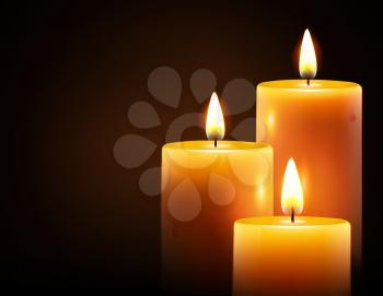 Vector illustration of three yellow candles on dark background