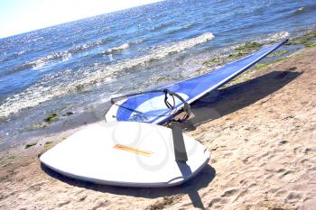 Royalty Free Photo of a Windsurfing Board on the Beach
