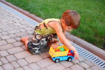 Royalty Free Photo of a Little Boy Playing