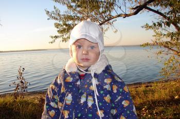 Royalty Free Photo of a Little Boy By the River