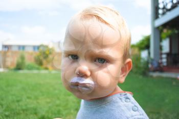 Royalty Free Photo of a Little Boy With Food on His Face