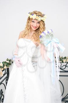 Royalty Free Photo of a Bride Holding a Bouquet
