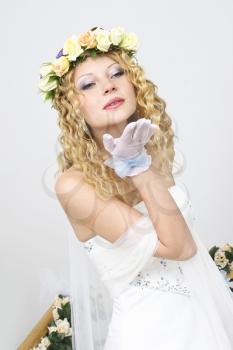 Royalty Free Photo of a Bride Blowing a Kiss