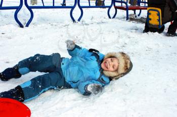 Royalty Free Photo of a Boy Playing in Snow