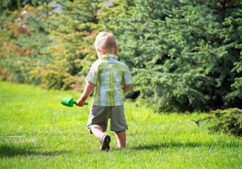 Royalty Free Photo of a Little Boy Playing Outside