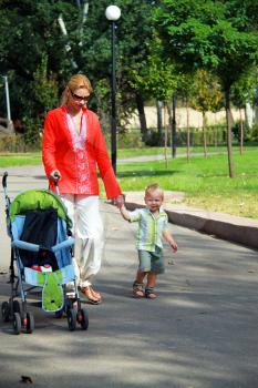 Royalty Free Photo of a Mother and Son Walking Outside