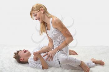 Royalty Free Photo of a Mother and Son Practicing Yoga