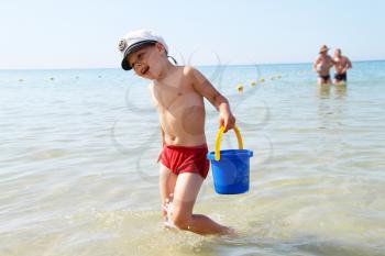 Royalty Free Photo of a Little Boy Playing on the Beach