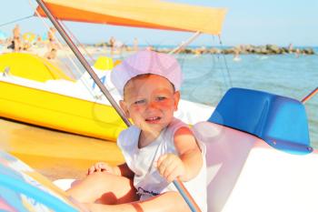 Royalty Free Photo of a Little Boy on a Boat
