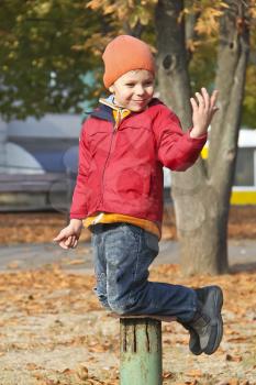 Royalty Free Photo of a Little Boy Playing in a Park