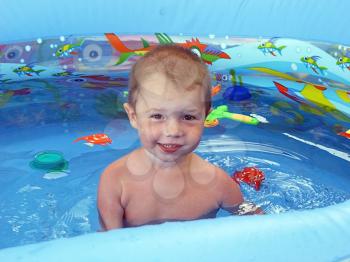 Royalty Free Photo of a Boy in an Inflatable Pool