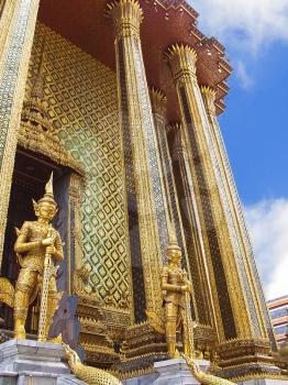 Royalty Free Photo of the Guards of the Temple Wat Phra Kaew in the Grand Palace in Bangkok, Thailand