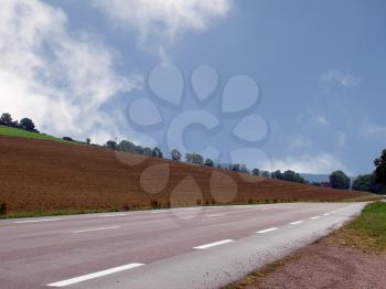 Royalty Free Photo of a Road Through Fields