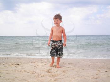 Royalty Free Photo of a Little Boy at the Beach