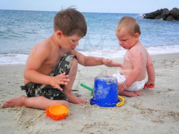 Royalty Free Photo of Two Little Boys Playing at the Beach