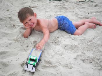 Royalty Free Photo of a Boy Playing in the Sand