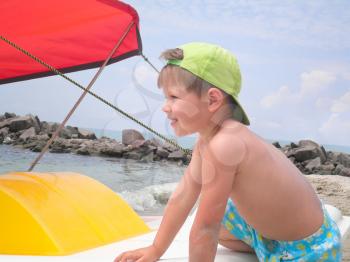 Royalty Free Photo of a Boy on a Boat