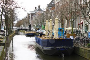 Restaurants on the canal of Delft in the early morning. Netherlands
