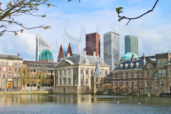 Binnenhof Palace - Dutch Parlament against the backdrop of modern buildings. Den Haag, Netherlands. 