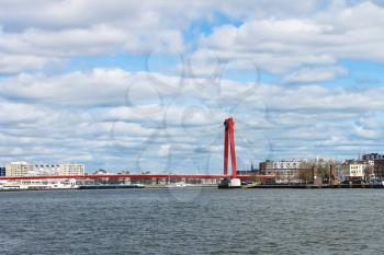  Red suspension bridge over  Maas in Rotterdam. Netherlands