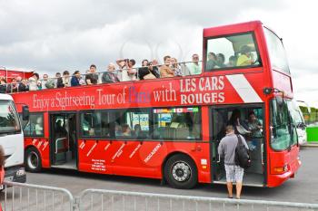 PARIS, FRANCE - JULY 10:Tourists bus in the heart of Paris on July 10, 2012. Paris is one of the most visited cities in the world.