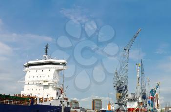 Industrial landscape. Ship and crane in shipyard 