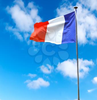 French flag on a background of blue sky